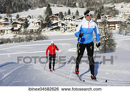 Stock Photograph - Classic cross-country skiers on the cross-country ski run, cross-country stadium, Reit im Winkl, Chiemgau, Upper Bavaria, Bavaria, Germany, Europe. Fotosearch