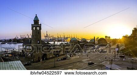 Stock Photo - Clock Tower, Gauging tower, St. Pauli landing stages with harbor at sunset, landing stages, Elbe, St. Pauli, Hamburg, Germany, Europe. Fotosearch