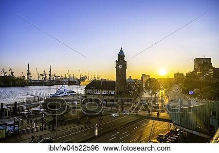Stock Photograph - Clock Tower, Gauging tower, St. Pauli landing stages with harbor at sunset, landing stages, Elbe, St. Pauli, Hamburg, Germany, Europe. Fotosearch