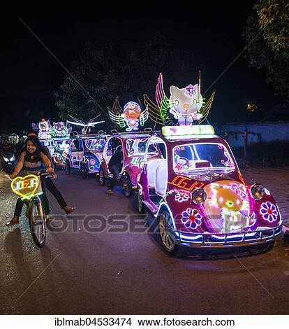 Picture - Colorful with LEDs illuminated cars, pedal car, Yogyakarta, Java, Indonesia, Asia. Fotosearch