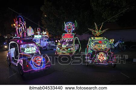 Stock Image - Colorful with LEDs illuminated cars, pedal car, Yogyakarta, Java, Indonesia, Asia. Fotosearch