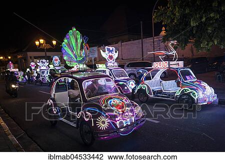 Stock Image - Colorful with LEDs illuminated cars, pedal car, Yogyakarta, Java, Indonesia, Asia. Fotosearch