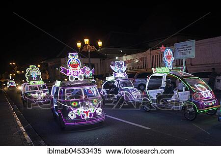 Stock Photography - Colorful with LEDs illuminated cars, pedal car, Yogyakarta, Java, Indonesia, Asia. Fotosearch