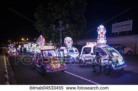 Stock Photography - Colorful with LEDs illuminated cars, pedal car, Yogyakarta, Java, Indonesia, Asia. Fotosearch