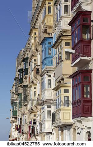 Stock Photography - Colorful wooden bay windows on facades, Marsamxett Street, historic centre, Valletta, Malta, Europe. Fotosearch