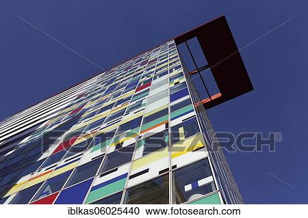 Stock Image - Colorium high-rise building, facade with coloured glass panels, architect William Alsop, Medienhafen Düsseldorf, North Rhine-Westphalia, Germany, Europe. Fotosearch