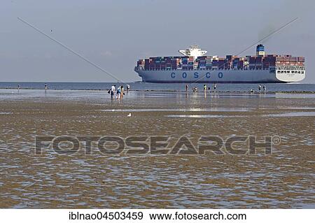 Container ship in the Wadden Sea, Cuxhaven, Lower Saxony, Germany, Europe View Large Photo Image Stock Photo - Container ship in the Wadden Sea, Cuxhaven, Lower Saxony, Germany, Europe. Fotosearch