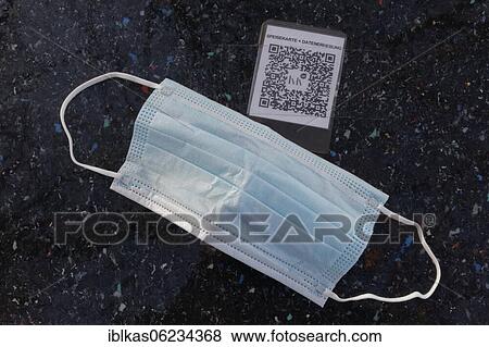 Stock Photo - Corona Restaurant Lockdown, face mask is on a table with QR code, outdoor gastronomy, Düsseldorf, North Rhine-Westphalia, Germany, Europe. Fotosearch