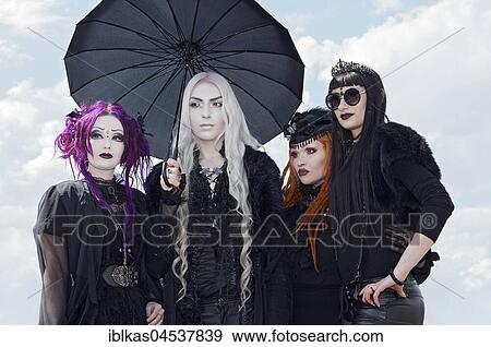 Stock Photo - Cosplay, four young woman dressed in gothic clothing, Japan Day 2017, Düsseldorf, North Rhine-Westphalia, Germany, Europe. Fotosearch