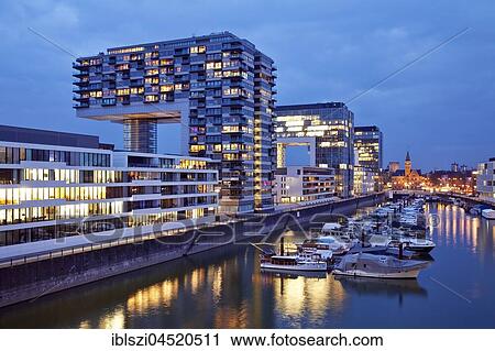 Stock Image - Crane houses at dusk, Rheinauhafen, Cologne, Rhineland, North Rhine-Westphalia, Germany, Europe. Fotosearch