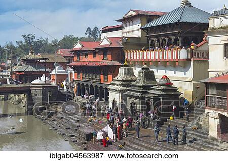 Cremation ghat along the Bagmati river, Pashupatinath Temple complex, Kathmandu, Nepal, Asia View Large Photo Image Stock Photo - Cremation ghat along the Bagmati river, Pashupatinath Temple complex, Kathmandu, Nepal, Asia. Fotosearch