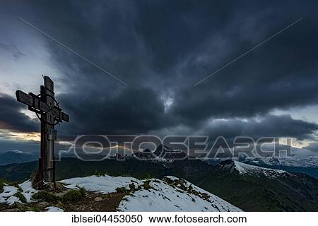 Cross on the summit of Zafernhorn with dark clouds, stormy atmosphere, Alpine panorama, Allgäu Alps, Damüls, Bregenzer Forest, Vorarlberg, Austria, Europe View Large Photo Image Stock Image - Cross on the summit of Zafernhorn with dark clouds, stormy atmosphere, Alpine panorama, Allgäu Alps, Damüls, Bregenzer Forest, Vorarlberg, Austria, Europe. Fotosearch