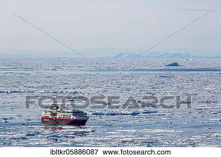 Stock Photo - Cruise ship in ice field, east coast of Greenland, Denmark, Europe. Fotosearch