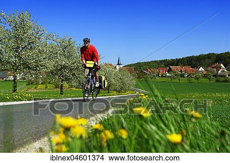 Picture - Cyclist at Moggast, Franconian Switzerland, Upper Franconia, Bavaria, Germany, Europe. Fotosearch