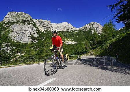 Cyclists on the pass road between Vrsic, Kranjska Gora, Julian Alps, Slovenia, Europe View Large Photo Image Stock Photo - Cyclists on the pass road between Vrsic, Kranjska Gora, Julian Alps, Slovenia, Europe. Fotosearch