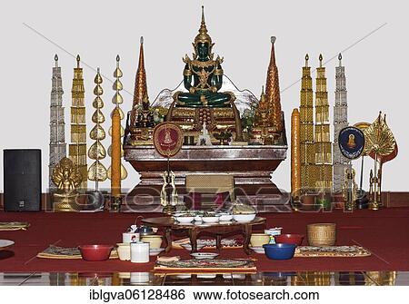 Donated food for monks in front of a small altar with a replica of the Emerald Buddha in meditation pose, Temple Wat Nong Sikhounmuang, Luang Prabang, Laos, Asia View Large Photo Image Stock Photograph - Donated food for monks in front of a small altar with a replica of the Emerald Buddha in meditation pose, Temple Wat Nong Sikhounmuang, Luang Prabang, Laos, Asia. Fotosearch