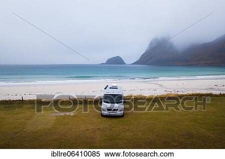Stock Photography - Drone shot, camping van on grass in front of a fine sandy beach, Haukland beach, Lofoten, Norway, Europe. Fotosearch