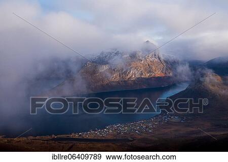 Stock Photo - Drone shot, view of the place Fjordgård a a pointed mountain, Senja, Norway, Europe. Fotosearch