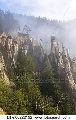 Earth pyramids near Perchau in the mist, South Tyrol, Italy, Europe View Large Photo Image Stock Image - Earth pyramids near Perchau in the mist, South Tyrol, Italy, Europe. Fotosearch