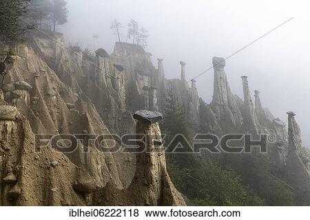 Earth pyramids near Perchau in the mist, South Tyrol, Italy, Europe View Large Photo Image Stock Photo - Earth pyramids near Perchau in the mist, South Tyrol, Italy, Europe. Fotosearch