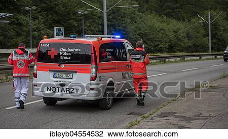 Stock Image - Emergency doctor in his emergency vehicle on the street, Germany, Europe. Fotosearch