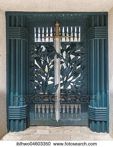 Stock Image - Entrance door to the bayonet moat, Symbolic sword with plant ornament on the portal, Battle of Verdun, First World War, Verdun, Lorraine, France, Europe. Fotosearch