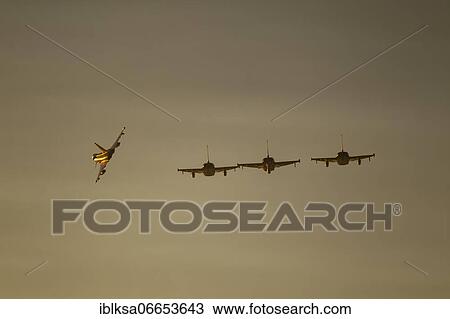 Stock Image - Eurofighter Typhoon four aircraft in flight of the Royal air force, Lincolnshire, England, United Kingdom, Europe. Fotosearch