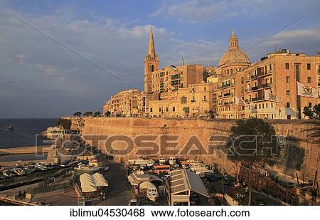Evening light on buildings and churches, dome Basilica of Our Lady and Mount Carmel church, Valletta, Malta, Europe View Large Photo Image Stock Photo - Evening light on buildings and churches, dome Basilica of Our Lady and Mount Carmel church, Valletta, Malta, Europe. Fotosearch