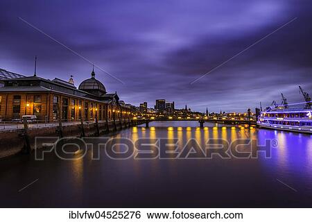 Stock Photograph - Event Center, former fish auction hall, Blue Hour, Twilight, Altona Fish Market, Elbe, Hamburg, Germany, Europe. Fotosearch
