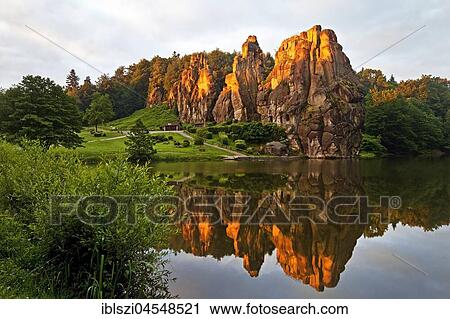 Stock Image - Extern stones, Externsteine, sunrise, sandstone formation, Teutoburg Forest, Horn-Bad Meinberg, North Rhine-Westphalia, Germany, Europe. Fotosearch