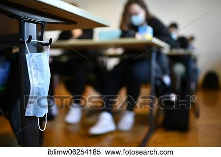 Face mask hangs on school desk, classroom instruction, corona crisis, Stuttgart, Baden-Württemberg, Germany, Europe View Large Photo Image Stock Photography - Face mask hangs on school desk, classroom instruction, corona crisis, Stuttgart, Baden-Württemberg, Germany, Europe. Fotosearch
