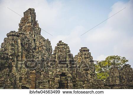 Stock Photo - Face Towers, Stone Faces, Bodhisattva Lokeshvara, Avalokiteshvara, Temple Ruins, Bayon Temple, Angkor Thom Complex, Angkor Archaeological Park, Siem Reap Province, Cambodia, Asia. Fotosearch