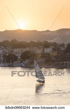 Feluccas on the river Nile at sunset, Aswan, Egypt, Africa View Large Photo Image Picture - Feluccas on the river Nile at sunset, Aswan, Egypt, Africa. Fotosearch