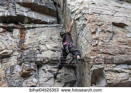 Female mountaineer, climber in a steep face, Banff National Park, Rocky Mountains, Alberta, Canada, North America View Large Photo Image Stock Image - Female mountaineer, climber in a steep face, Banff National Park, Rocky Mountains, Alberta, Canada, North America. Fotosearch