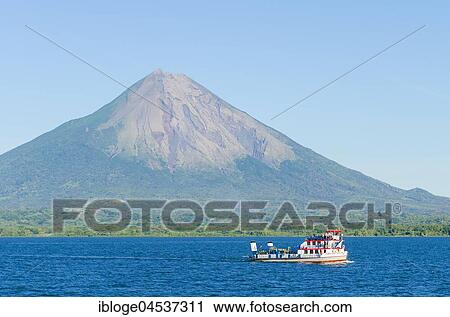 Ferry in front of the island of Ometepe with the volcano Concepcion, Nicaragua Lake (Lago Cocibolca), Nicaragua, Central America View Large Photo Image Stock Image - Ferry in front of the island of Ometepe with the volcano Concepcion, Nicaragua Lake (Lago Cocibolca), Nicaragua, Central America. Fotosearch