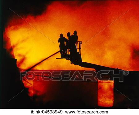 Stock Photo - Firefighters extinguish a fire, England, Great Britain. Fotosearch