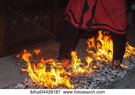 Stock Photo - Firewalking, man running barefoot on hot coals, Kandy, Central Province, Sri Lanka, Asia. Fotosearch
