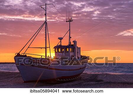 Fishing boat on the beach at sunset, Vorupör, Nordjylland, Denmark, Europe View Large Photo Image Stock Image - Fishing boat on the beach at sunset, Vorupör, Nordjylland, Denmark, Europe. Fotosearch