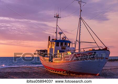 Fishing boat on the beach at sunset, Vorupör, Nordjylland, Denmark, Europe View Large Photo Image Stock Photo - Fishing boat on the beach at sunset, Vorupör, Nordjylland, Denmark, Europe. Fotosearch