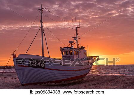 Fishing boat on the beach at sunset, Vorupör, Nordjylland, Denmark, Europe View Large Photo Image Stock Photo - Fishing boat on the beach at sunset, Vorupör, Nordjylland, Denmark, Europe. Fotosearch
