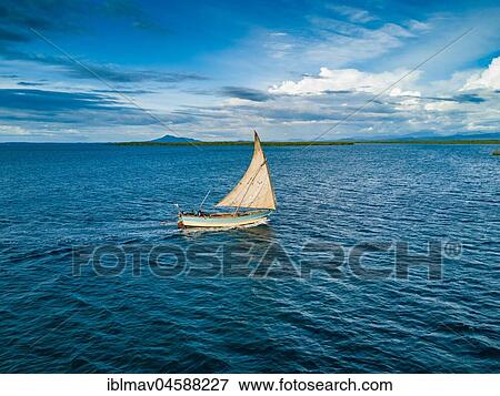 Fishing boat, sailboat off the island of Ankify, North Madagascar, Madagascar, Africa View Large Photo Image Stock Photo - Fishing boat, sailboat off the island of Ankify, North Madagascar, Madagascar, Africa. Fotosearch