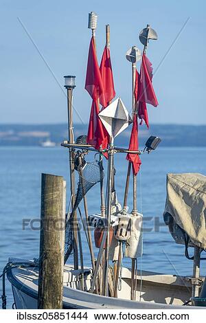 Fishing boat with red flags, Vitt, Kap Arkona, Mecklenburg-Western Pomerania, Germany, Europe View Large Photo Image Picture - Fishing boat with red flags, Vitt, Kap Arkona, Mecklenburg-Western Pomerania, Germany, Europe. Fotosearch