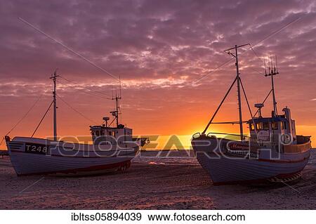 Fishing boats on the beach at sunset, Vorupör, Nordjylland, Denmark, Europe View Large Photo Image Stock Photo - Fishing boats on the beach at sunset, Vorupör, Nordjylland, Denmark, Europe. Fotosearch