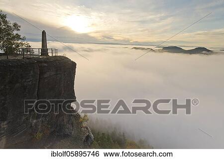 Fog in the Elbe Valley, Saxony, Germany, sunrise on Lilienstein with view into Saxon Switzerland on Pfaffenstein and Gorisch, National Park Saxon Switzerland, Europe View Large Photo Image Stock Photograph - Fog in the Elbe Valley, Saxony, Germany, sunrise on Lilienstein with view into Saxon Switzerland on Pfaffenstein and Gorisch, National Park Saxon Switzerland, Europe. Fotosearch