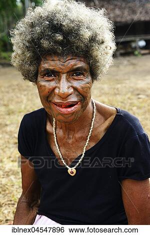 Folk tribe Korafe, woman with typical tattoo on her face, Tufi, Papua New Guinea, Oceania View Large Photo Image Stock Photograph - Folk tribe Korafe, woman with typical tattoo on her face, Tufi, Papua New Guinea, Oceania. Fotosearch
