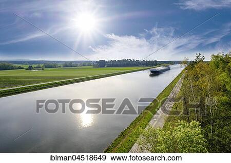 Freightship on Main-Danube Canal, near Hilpoltstein, Franconian lakeland, Middle Franconia, Franconia, Bavaria, Germany, Europe View Large Photo Image Stock Photo - Freightship on Main-Danube Canal, near Hilpoltstein, Franconian lakeland, Middle Franconia, Franconia, Bavaria, Germany, Europe. Fotosearch