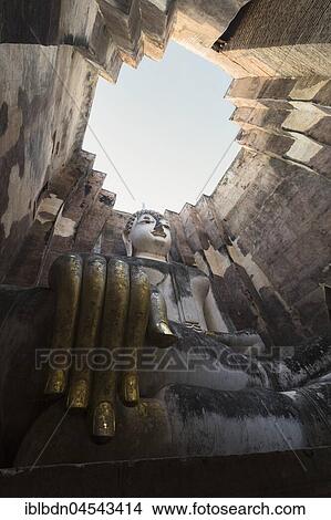 Giant Buddha statue, Wat Si Chum, Sukhothai historical park, Sukhothai, Thailand, Asia View Large Photo Image Picture - Giant Buddha statue, Wat Si Chum, Sukhothai historical park, Sukhothai, Thailand, Asia. Fotosearch