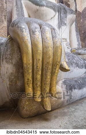 Stock Photography - Gilded hand of Phra Atchana Buddha, Wat Si Chum Temple, Sukhothai, Thailand, Asia. Fotosearch