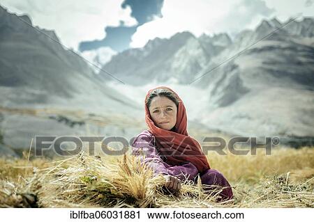 Girl, 6 years, sitting in a wheat field, behind her the foothills of the Hindu Kush, Saradh-e-Broghil Wakhan Corridor, Afghanistan, Asia View Large Photo Image Stock Image - Girl, 6 years, sitting in a wheat field, behind her the foothills of the Hindu Kush, Saradh-e-Broghil Wakhan Corridor, Afghanistan, Asia. Fotosearch