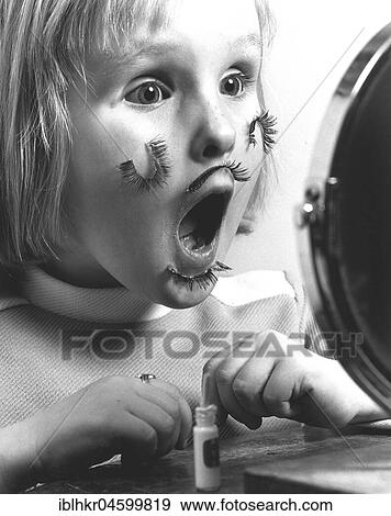 Stock Photo - Girl with false eyelashes, England, Great Britain. Fotosearch